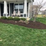 Bark Mulch Installation In Corner Garden Bed By GroundSmith